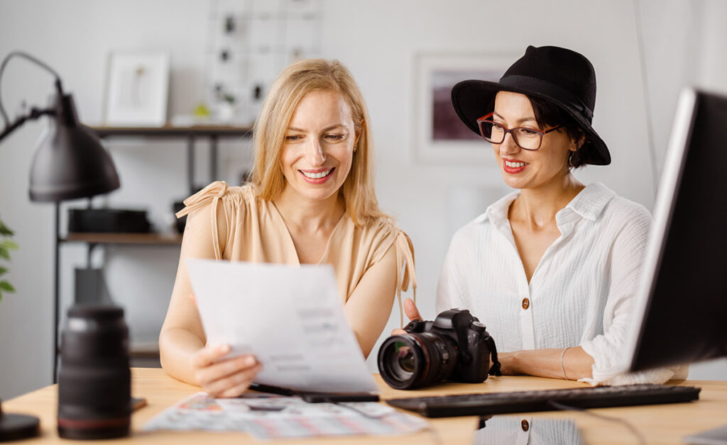 Photographer and client at office