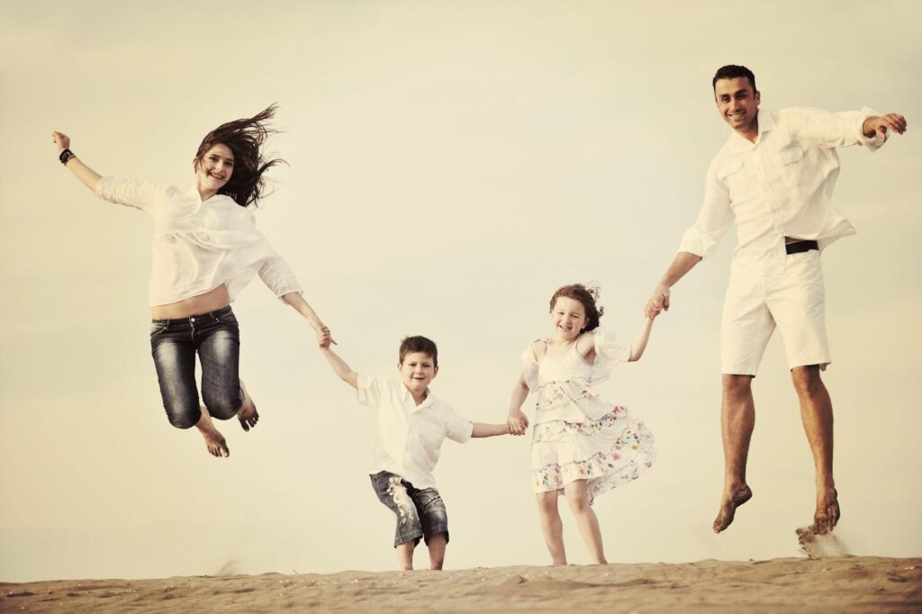 happy young family have fun on beach